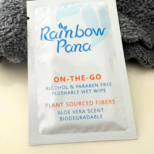 Front of Individually Packaged Wet Wipe for Travel by Rainbow Pana