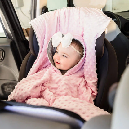 car seat poncho on baby girl in car seat - pink