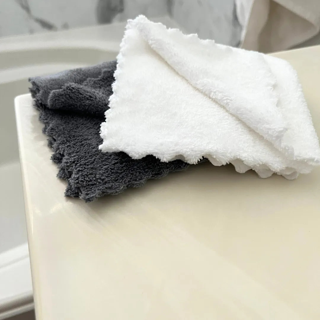makeup removal clothes on a bathroom counter (gray and white)